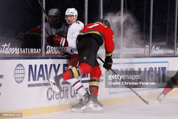 Alex Pietrangelo of the Vegas Golden Knights checks Joonas Donskoi of the Colorado Avalanche into the boards during the third period during the NHL...