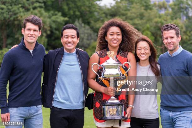 Naomi Osaka of Japan and her entourage including her coach Wim Fissette and physical trainer Natsuko Mogi pose with the Daphne Akhurst Memorial...