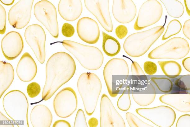 conference pear slices back lit pattern - pera fotografías e imágenes de stock