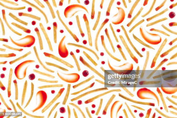 french fries and ketchup back lit pattern - frites stock pictures, royalty-free photos & images