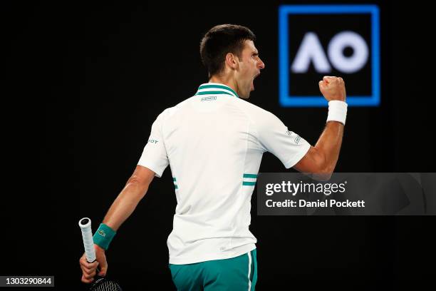 Novak Djokovic of Serbia celebrates a point in his Men’s Singles Final match against Daniil Medvedev of Russia during day 14 of the 2021 Australian...