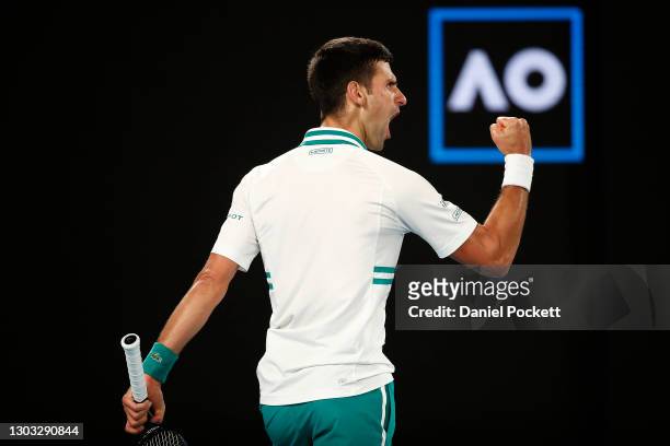 Novak Djokovic of Serbia celebrates a point in his Men’s Singles Final match against Daniil Medvedev of Russia during day 14 of the 2021 Australian...