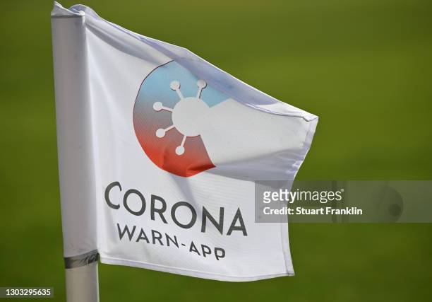 Flag showing the Corona Warn-App is seen during the Second Bundesliga match between VfL Osnabrück and 1. FC Heidenheim 1846 at Stadion an der Bremer...