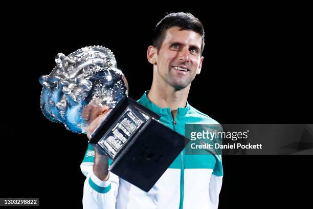 Novak Djokovic of Serbia kisses the Norman Brookes Challenge Cup as he celebrates victory in his Men’s Singles Final match against Daniil Medvedev of...