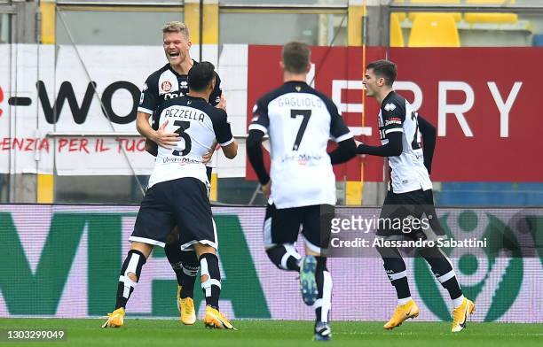 Andreas Cornelius of Parma Calcio 1913 celebrates with team mates Giuseppe Pezzella and Valentin Mihaila after scoring their side's first goal during...
