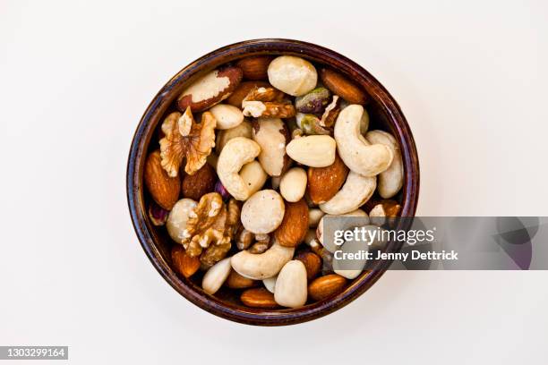 bowl of nuts - noot stockfoto's en -beelden