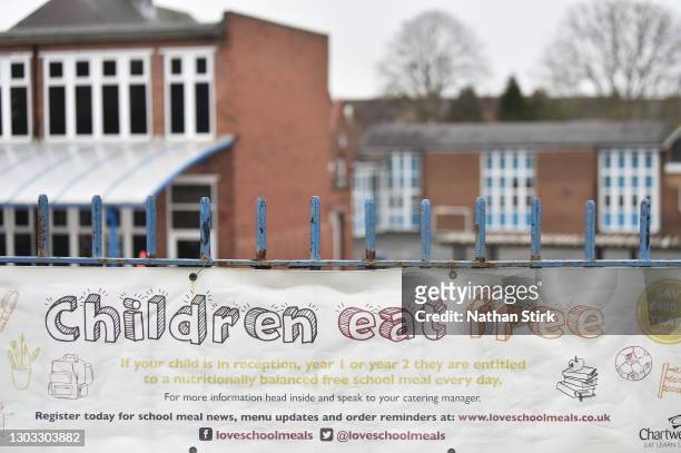 Children eat free' sign is displayed outside The Reginald Mitchell Primary School on February 21, 2021 in Talke, United Kingdom. After a surge of...