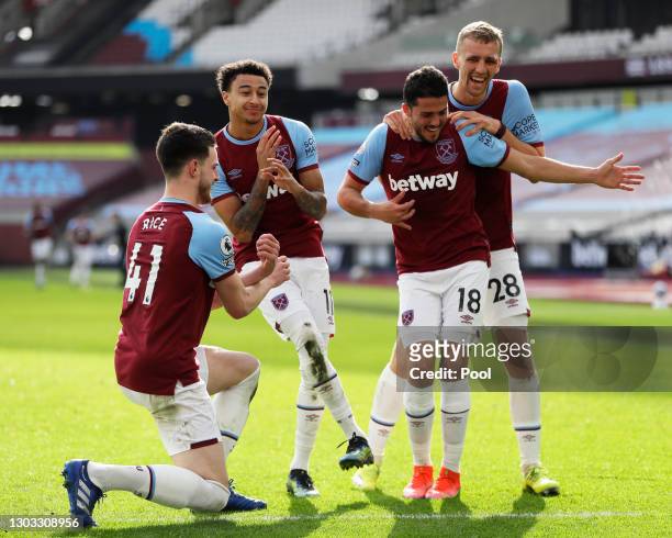 Jesse Lingard of West Ham United celebrates with team mates Declan Rice, Pablo Fornals and Tomas Soucek after scoring their side's second goal during...
