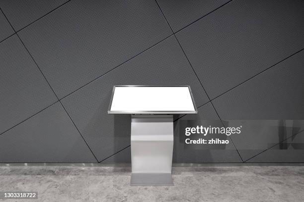 front view of an electronic display screen placed against a metal wall - consumer electronics trade fair stock pictures, royalty-free photos & images