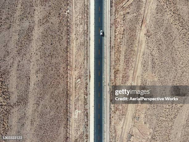 aerial view of highway in the desert - desert highway stock pictures, royalty-free photos & images