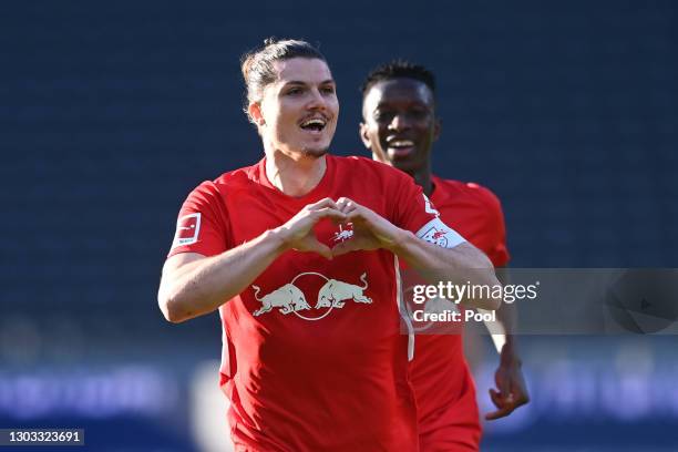 Marcel Sabitzer of RB Leipzig celebrates after scoring their side's first goal during the Bundesliga match between Hertha BSC and RB Leipzig at...