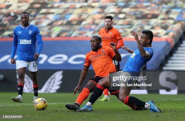 Alfredo Morelos of Rangers is tackled by Jeando Fuchs of Dundee United leading to a penalty being awarded during the Ladbrokes Scottish Premiership...