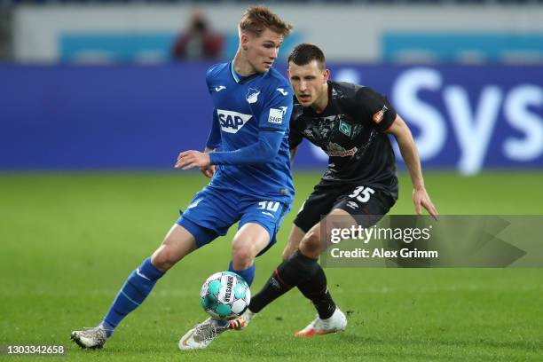 Marco John of TSG 1899 Hoffenheim is closed down by Maximilian Eggestein of SV Werder Bremen during the Bundesliga match between TSG Hoffenheim and...