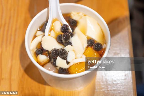 asian dessert, sweet taro ball with soy bean pudding and curd with sugar water - taro stock pictures, royalty-free photos & images