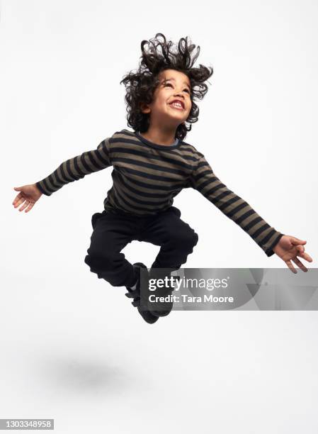 young boy jumping - child isolated foto e immagini stock