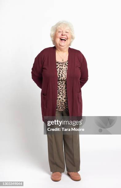full length of senior woman laughing - only senior women stock pictures, royalty-free photos & images