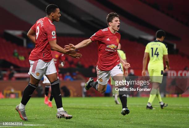 Daniel James of Manchester United celebrates with Anthony Martial after scoring his team's second goal during the Premier League match between...
