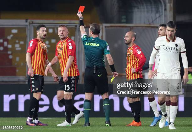 Kamil Glik of Benevento Calcio is shown a red card by Referee Luca Pairetto during the Serie A match between Benevento Calcio and AS Roma at Stadio...