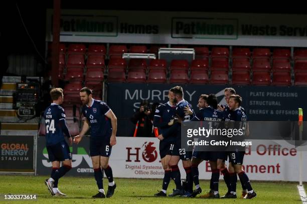 Jordan White of Ross County celebrates with team mates after scoring his team's first goal during the Ladbrokes Scottish Premiership between Ross...