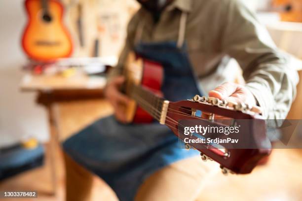 closeup view on tuning peg - music shop stock pictures, royalty-free photos & images