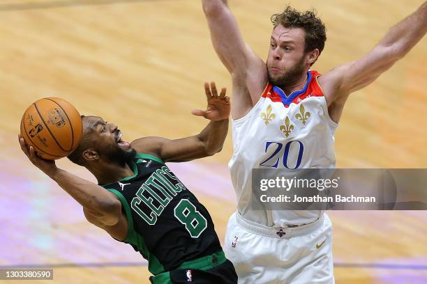 Kemba Walker of the Boston Celtics drives against Nicolo Melli of the New Orleans Pelicans during the second half at the Smoothie King Center on...