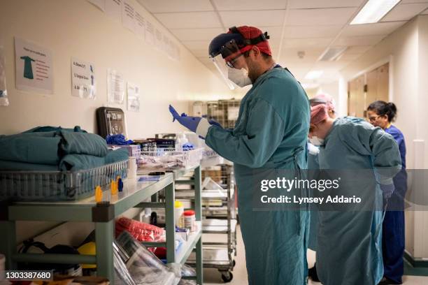 Medical staff wearing protective medical equipment before entering Covid intensive care ward at University Hospital Coventry on May 25, 2020 in...