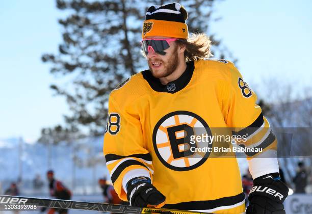 David Pastrnak of the Boston Bruins attends warm ups before playing against the Philadelphia Flyers in the 2021 NHL Outdoors Sunday presented by...