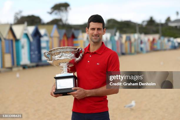 Novak Djokovic of Serbia poses with the Norman Brookes Challenge Cup after winning the 2021 Australian Open Men's Final, at Brighton Beach on...