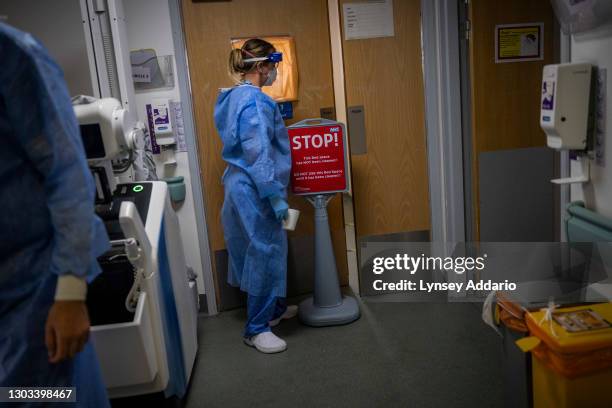 Medical staff of the Blackpool Victoria Hospital wear personal protective equipment before entering a designated "red zone", which has highly...