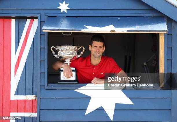 Novak Djokovic of Serbia poses with the Norman Brookes Challenge Cup after winning the 2021 Australian Open Men's Final, at Brighton Beach on...