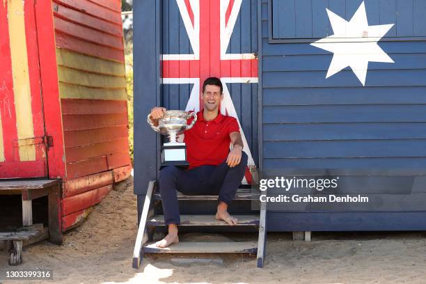 Novak Djokovic of Serbia poses with the Norman Brookes Challenge Cup after winning the 2021 Australian Open Men's Final, at Brighton Beach on...