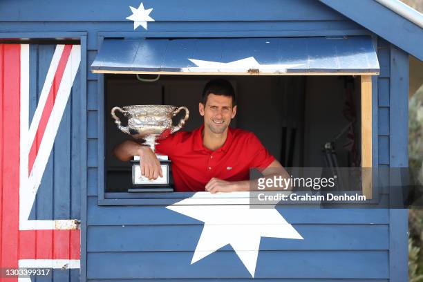 Novak Djokovic of Serbia poses with the Norman Brookes Challenge Cup after winning the 2021 Australian Open Men's Final, at Brighton Beach on...