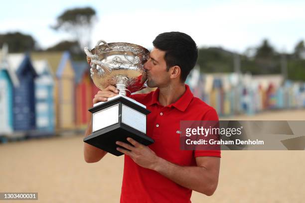 Novak Djokovic of Serbia kisses the Norman Brookes Challenge Cup after winning the 2021 Australian Open Men's Final, at Brighton Beach on February...