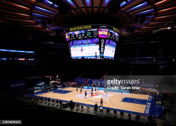 The Minnesota Timberwolves and the New York Knicks compete for the tip off at center court during the first half at Madison Square Garden on February...