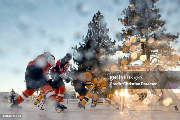 Sean Couturier of the Philadelphia Flyers scores a first period goal past Tuukka Rask of the Boston Bruins during the 'NHL Outdoors At Lake Tahoe' at...