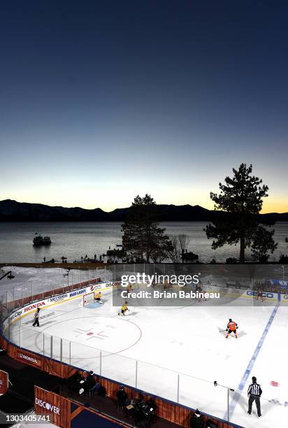 An overhead scenic view of the Boston Bruins playing against the Philadelphia Flyers in the second period of the 2021 NHL Outdoors Sunday presented...