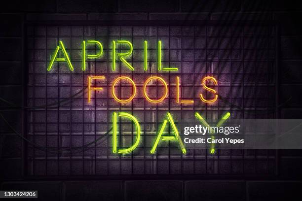 phrase 'april fools day in neon style - april fools day stock pictures, royalty-free photos & images