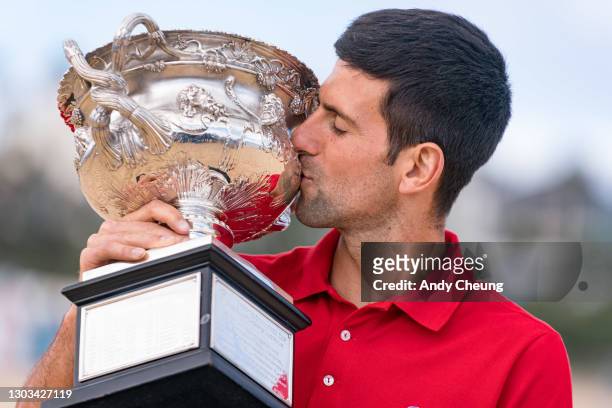 Novak Djokovic of Serbia kisses the Norman Brookes Challenge Cup after winning the 2021 Australian Open Men's Final, at Brighton Beach on February...