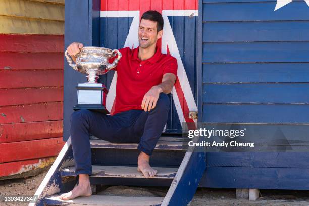 Novak Djokovic of Serbia poses with the Norman Brookes Challenge Cup after winning the 2021 Australian Open Men's Final, at Brighton Beach on...