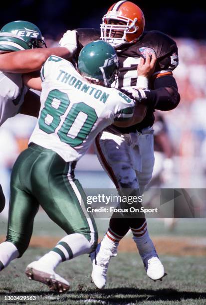 Pepper Johnson of the Cleveland Browns fights off the block of James Thornton of the New York Jets during an NFL football game October 2, 1994 at...