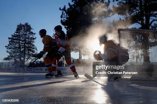 Goaltender Tuukka Rask of the Boston Bruins follows the play as Joel Farabee of the Philadelphia Flyers and Jeremy Lauzon set up in front during the...