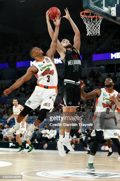 Scott Machado of the Taipans defends Jock Landale of Melbourne United during the NBL Cup match between Melbourne United and the Cairns Taipans at...