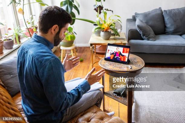man having online therapy session with psychotherapist - psychotherapy stock pictures, royalty-free photos & images