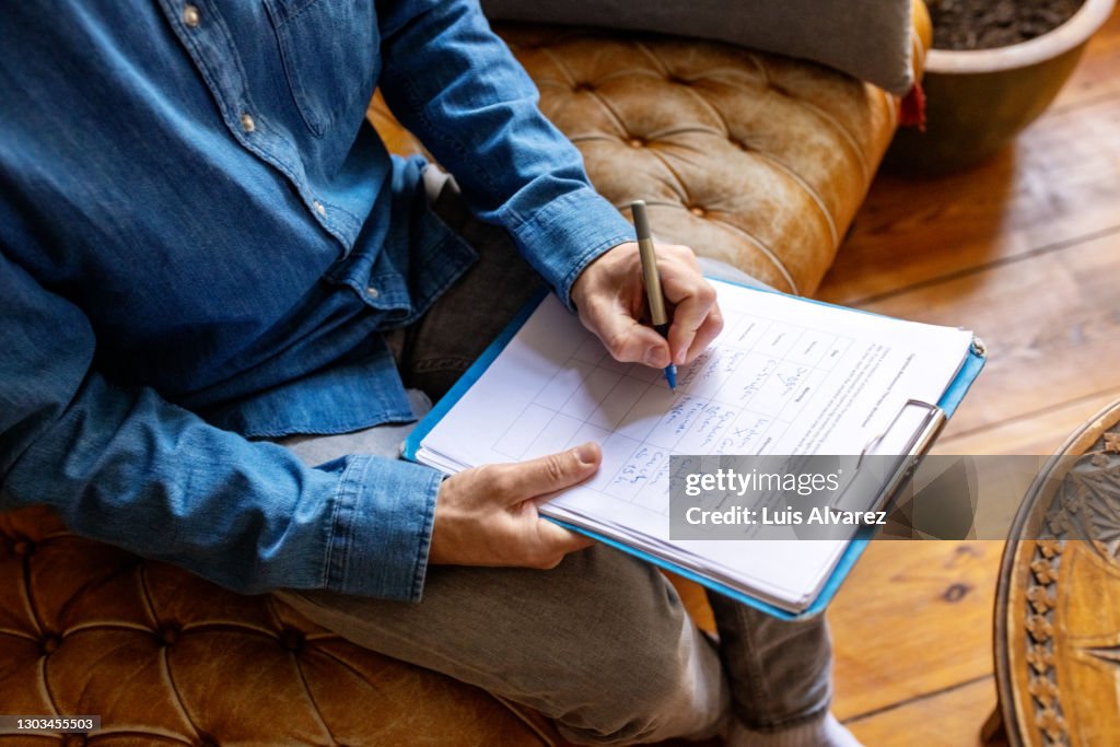 Psychotherapist takes notes during therapy session
