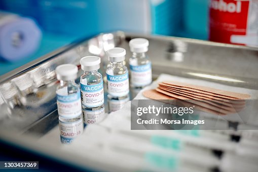 Vials With the Covid-19 Vaccine and Syringes are Displayed On a Tray at the Corona Vaccination Center Vials With the Covid-19 Vaccine and Syringes are Displayed On a Tray at the Corona Vaccination Center