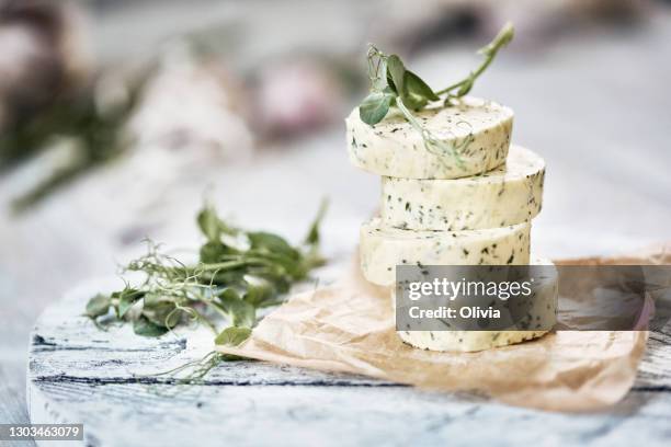 herb butter on cutting board - garlic stock pictures, royalty-free photos & images