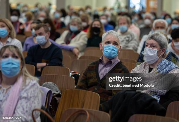 Socially distanced worshippers attend Sunday mass at the evangelical Christian Open Door Church on February 21, 2021 in Mulhouse, eastern France. A...