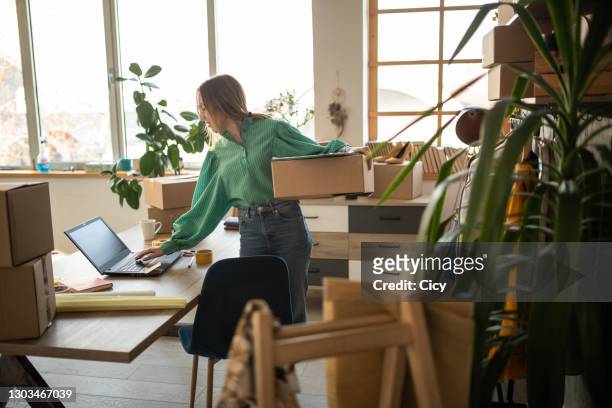 young working hard to satisfy all her online fashion shop customers - entrepreneur stock pictures, royalty-free photos & images