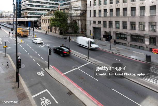 traffic on a busy city street - car traffic light stock pictures, royalty-free photos & images