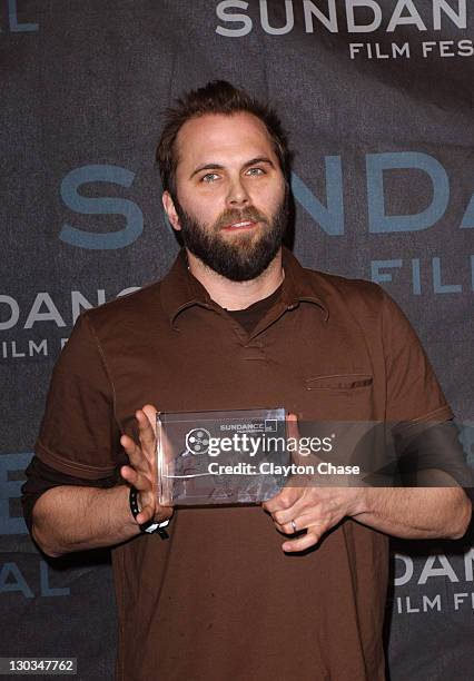 Chris Gorak, director, accepting for Tom Richmond, cinematographer of "Right at Your Door" and winner for Excellence in Cinematography
